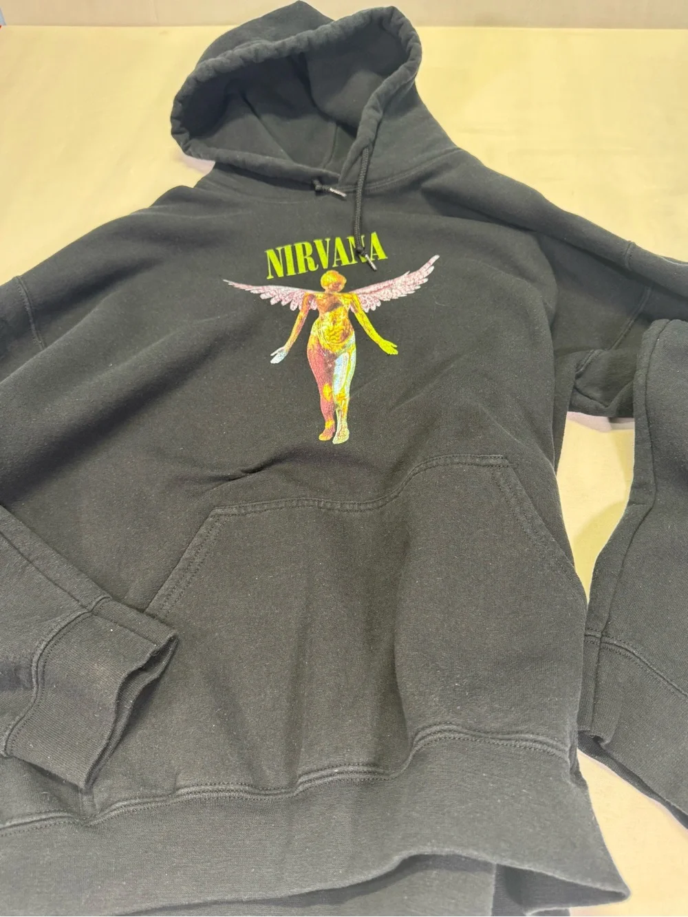 NIRVANA Black Crewneck Hoodie with Yellow-Green Logo and Multicolor Angel